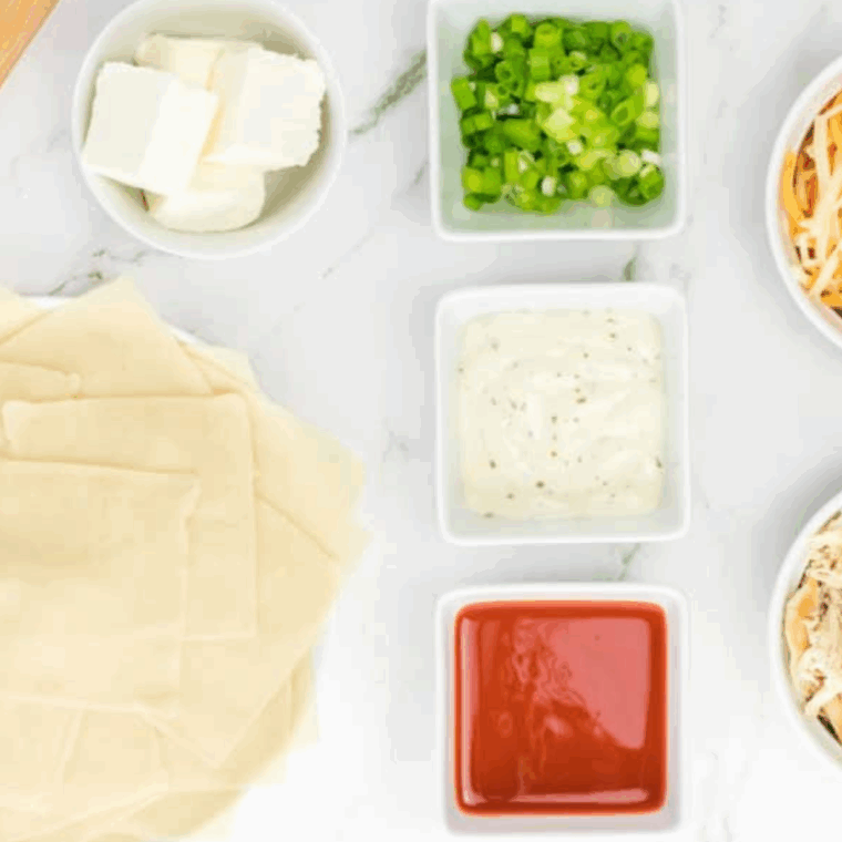 Ingredients needed for Air Fryer Buffalo Chicken Wontons on kitchen table.