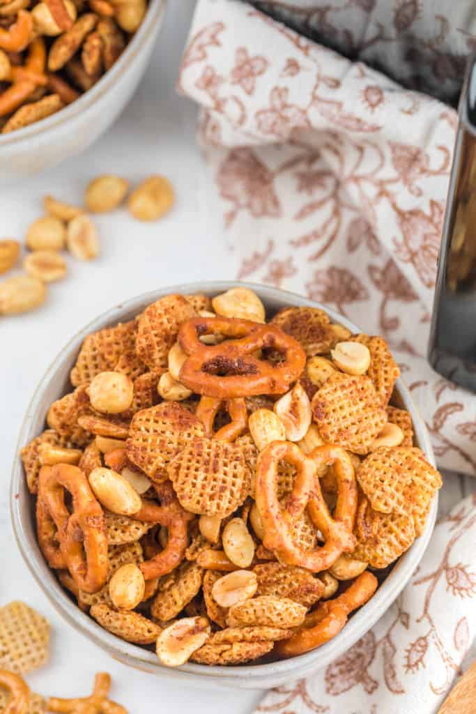 This Air Fryer Chex Party Mix Recipe is a crunchy snack for any occasion. Made with Chex cereal, mixed nuts, pretzels, and delicious seasonings!