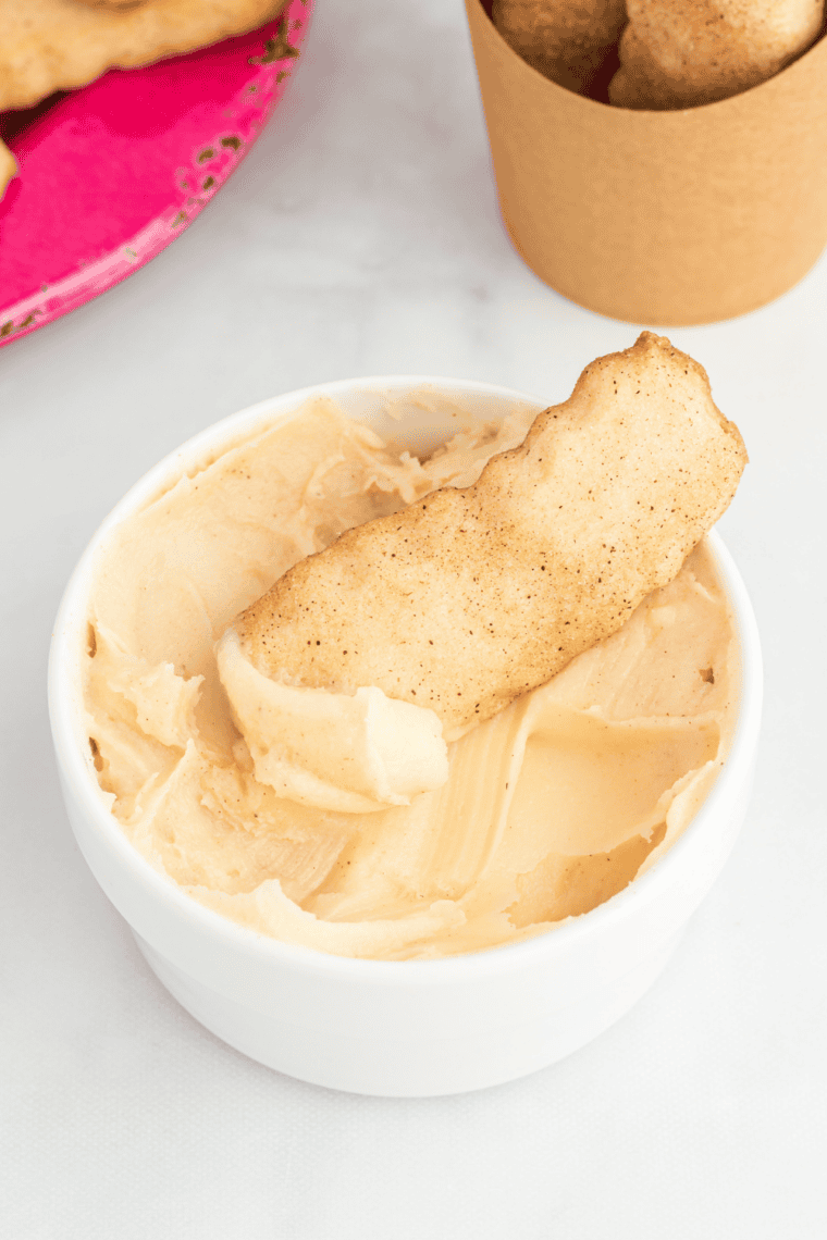 Plate of soft, chewy Snickerdoodle Cookie Fries with cinnamon cream cheese dip on the side.