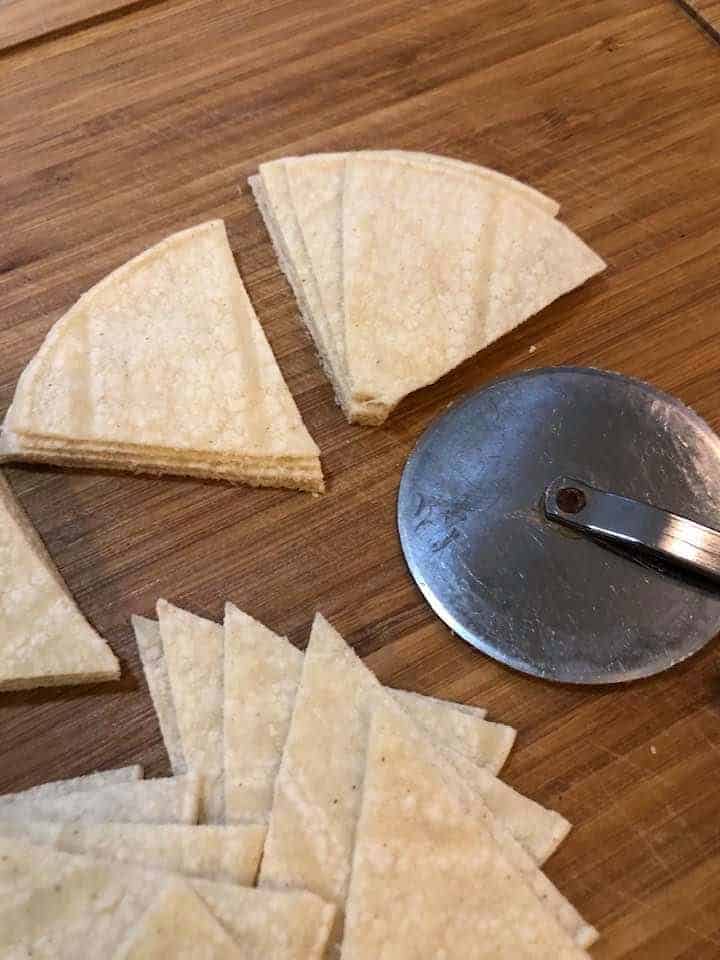 tortillas sliced with pizza cutter to make chips