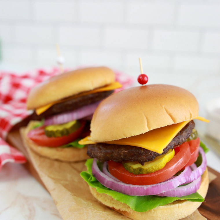 Juicy air fryer Bubba Burger with lettuce, tomato, and toasted bun served on plate