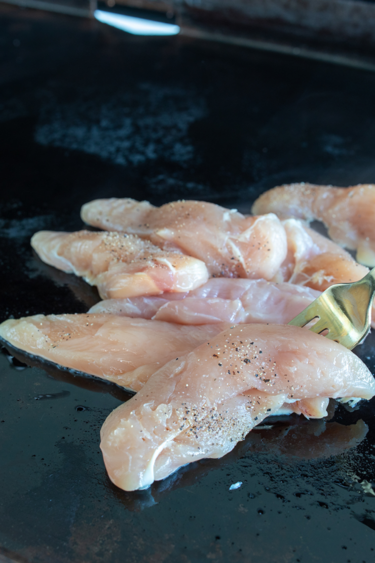Chicken cooking on the Blackstone Griddle.