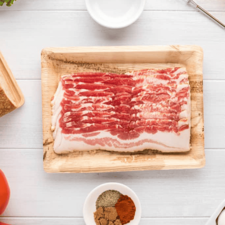 Ingredients needed for How to Cook Bacon on Blackstone Griddle on kitchen table.