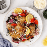 Air Fryer Greek Chicken with summer vegetables is a one-basket Mediterranean dinner—juicy lemon-herb thighs, peppers, onion, and olives in just 25 minutes.