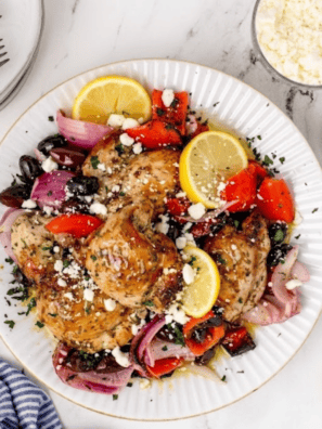 Air Fryer Greek Chicken with summer vegetables is a one-basket Mediterranean dinner&mdash;juicy lemon-herb thighs, peppers, onion, and olives in just 25 minutes.