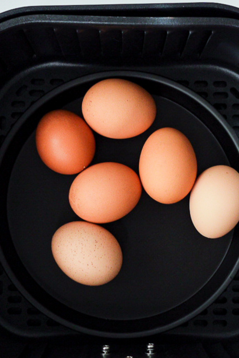 Preheating air fryer to 270&ndash;275&deg;F for gently cooking eggs evenly from shell to yolk