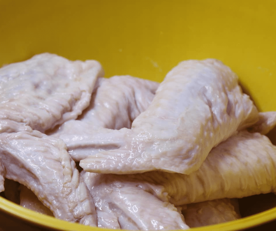 Preparation:

Start by cleaning the turkey wings thoroughly, removing any feathers or unwanted bits. Pat them dry using paper towels.
2. Brining (Optional but recommended for added flavor):

Combine 4 cups of water, 1/4 cup kosher salt, 1/4 cup brown sugar, 2 tablespoons apple cider vinegar, 2 tablespoons Worcestershire sauce, and 1 tablespoon liquid smoke (if you're not using already smoked wings) in a large container.
Add the turkey wings, ensuring they're submerged.
Refrigerate for at least 2 hours, preferably overnight, for the flavors to infuse.
3. Seasoning:

In a bowl, mix together 1 tablespoon smoked paprika, 1 tablespoon garlic powder, 1 tablespoon onion powder, 2 teaspoons black pepper, 1 teaspoon cayenne pepper, 1 teaspoon dried thyme, and 1 teaspoon dried oregano.
Remove the wings from the brine (if you used it) and pat dry. Rub them generously with the spice mix.
4. Air Frying:

Preheat your air fryer to 375°F (190°C) for about 5 minutes. If your air fryer doesn't have a preheat function, you can run it empty for 5 minutes.
Lightly coat or spray the turkey wings with olive oil or cooking spray to help them crisp up.
Place the wings in a single layer in the air fryer basket, ensuring they aren't overcrowded (you might need to cook in batches depending on the size of your fryer).
Cook for 25-30 minutes, turning the wings halfway through to ensure even cooking. They should be golden brown and have an internal temperature of at least 165°F (74°C).
5. Serving:

Once done, transfer them to a plate and let them rest for a few minutes. This helps in retaining their juiciness.
Garnish with freshly chopped parsley or cilantro if desired and serve with lemon or lime wedges on the side.