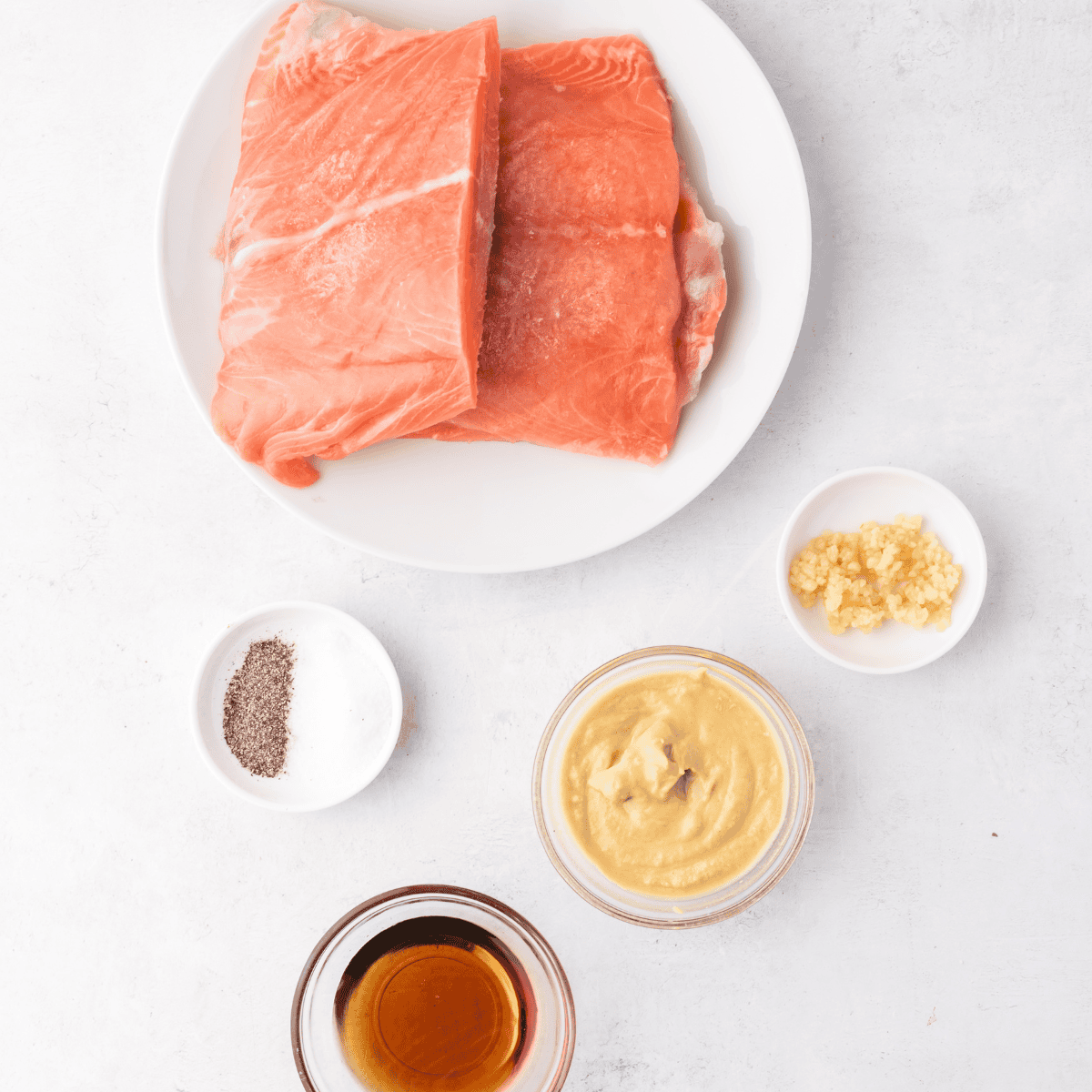 Ingredients needed for Cheesecake Factory Miso Salmon Recipe on kitchen table.