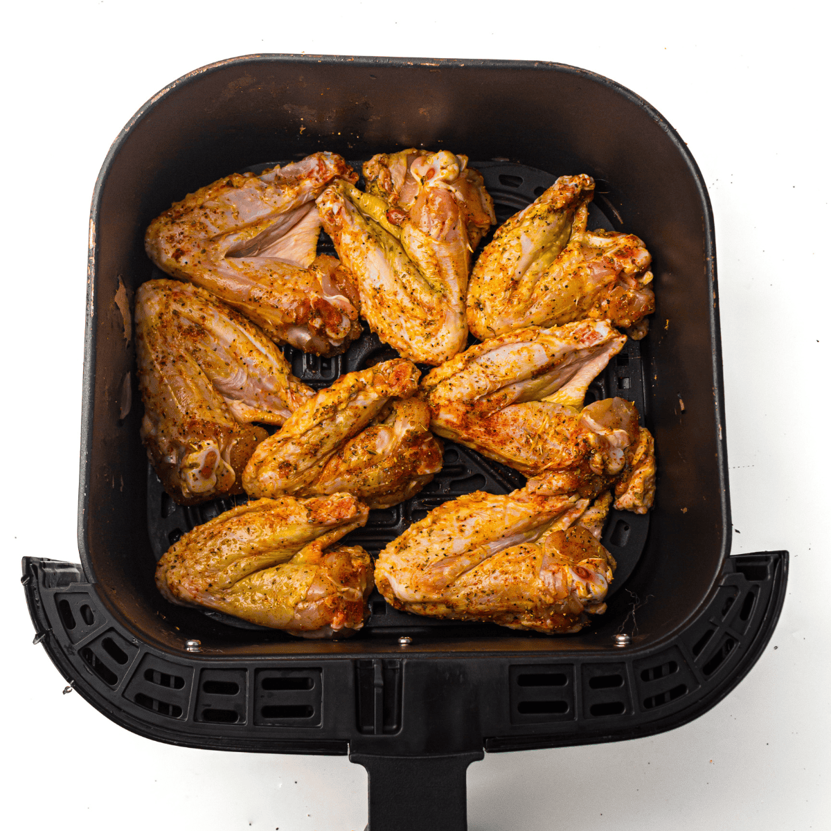 Copycat Air Fryer Domino’s Garlic Parmesan Wings in the air fryer basket.