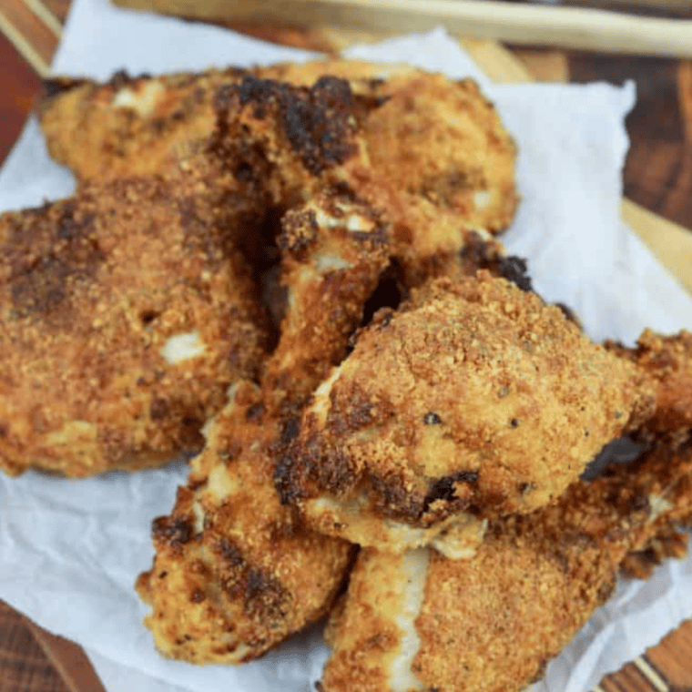 Golden brown keto Southern-style air fryer drumsticks arranged on a plate, ready to serve
