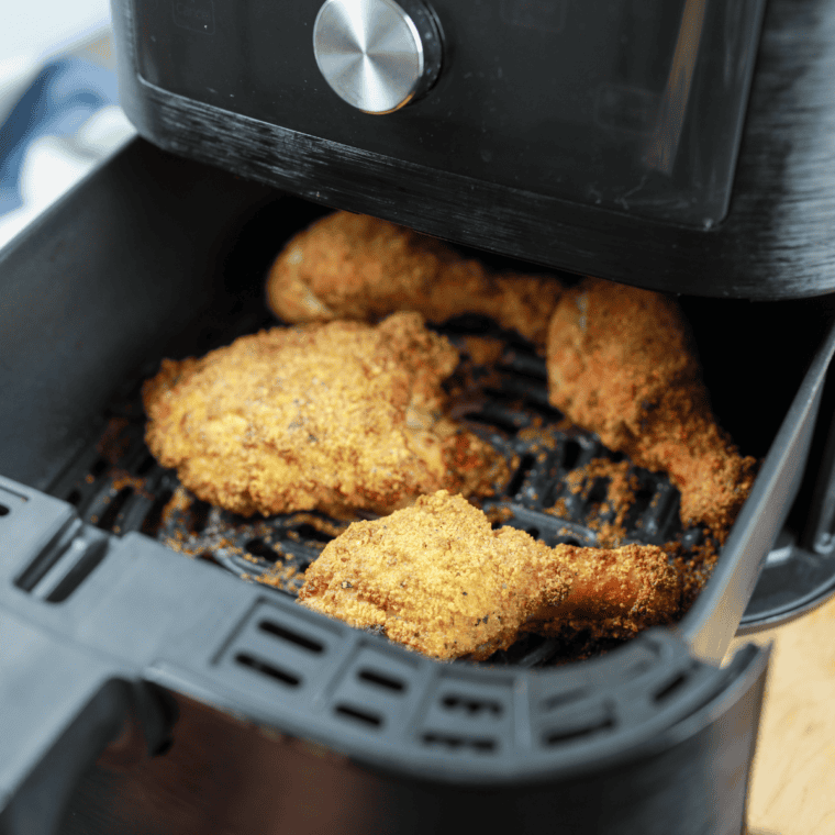 Crispy keto Southern air fryer drumsticks with golden seasoning, served on a white plate