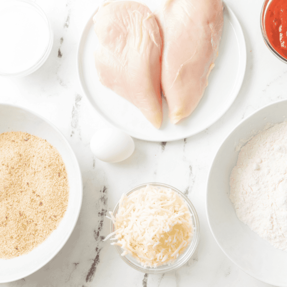 Maggiano’s Little Italy Chicken Parmesan Recipe ingredients on kitchen table.