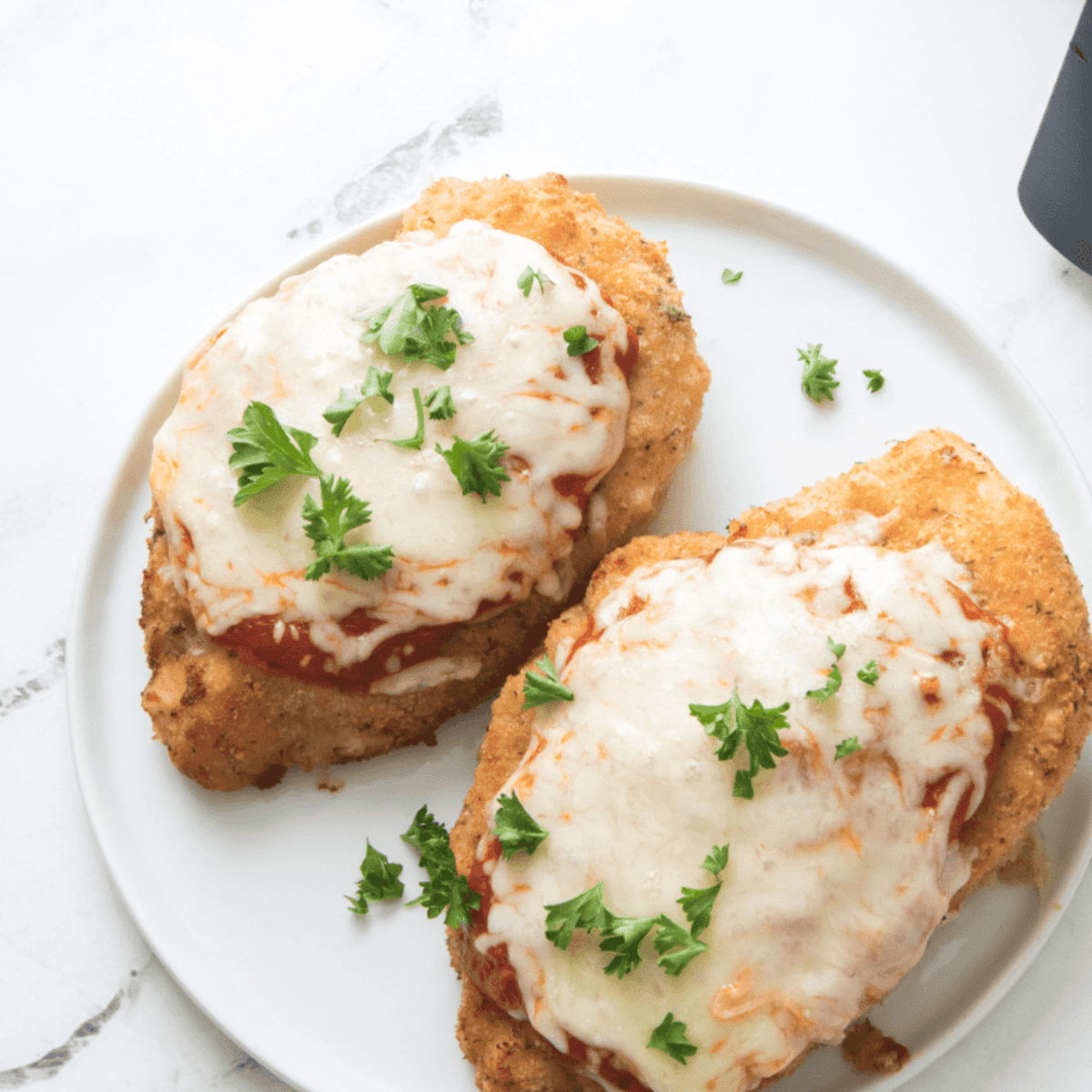 Homemade Maggiano’s Little Italy Chicken Parmesan with marinara and melted mozzarella.