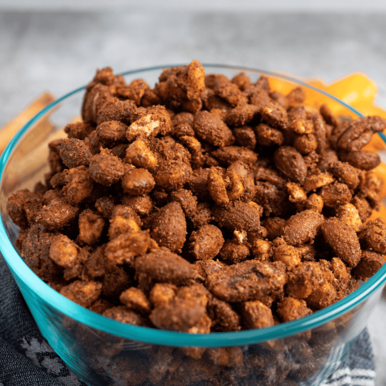 Crunchy Air Fryer Barbecue Roasted Mixed Nuts with a smoky, sweet glaze, served in a bowl.