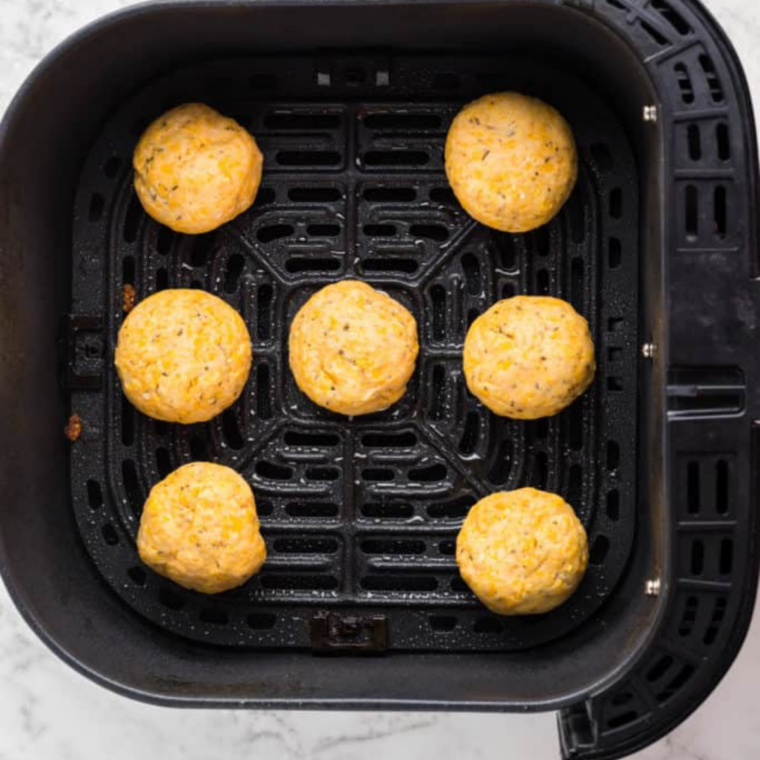 Scooping dough into uniform balls for air fryer cheese puffs