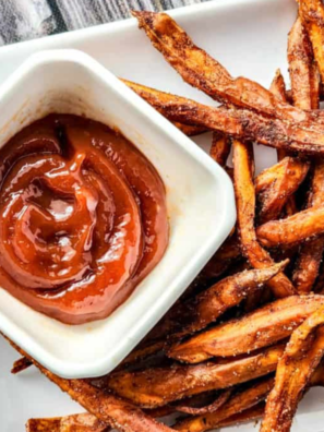 "Crispy Air Fryer cinnamon sweet potato fries sprinkled with cinnamon sugar."