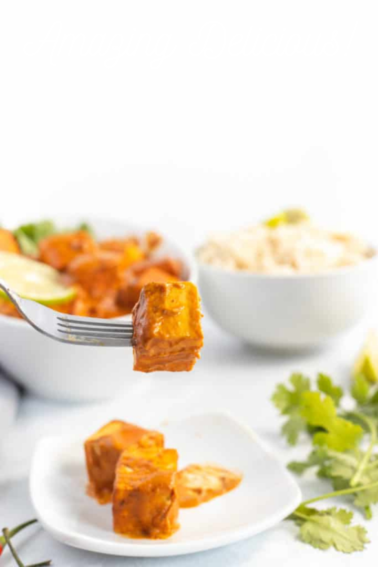 Healthy Air Fryer Curry Tofu dish with a vibrant curry sauce.