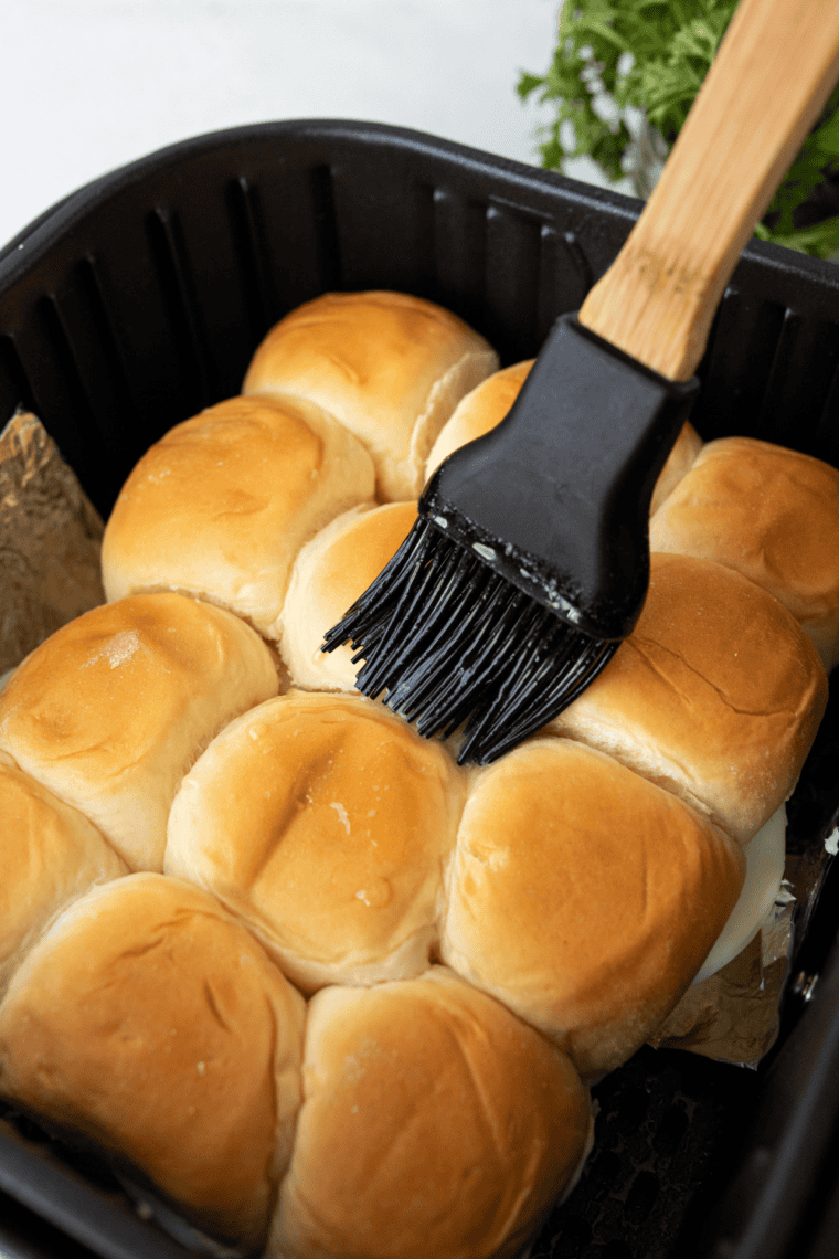 Air Fryer Italian Beef Sliders with melted mozzarella cheese, Italian beef, and a golden buttery, garlicky top.