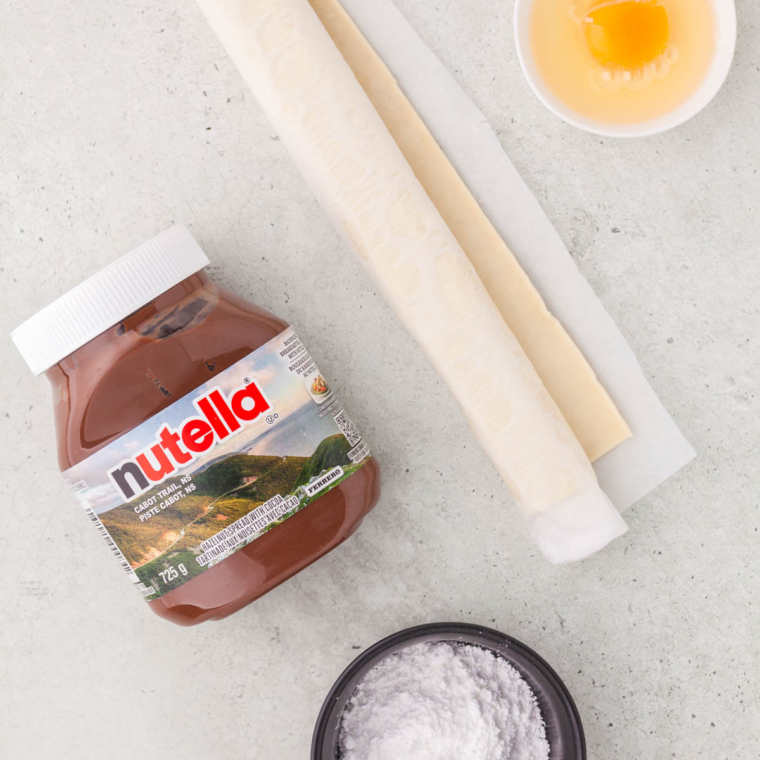 Ingredients needed for Air Fryer Nutella Bombs on kitchen table.