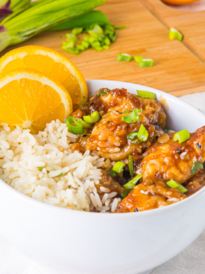 Bowl of Air Fryer Orange Chicken in white bowl.