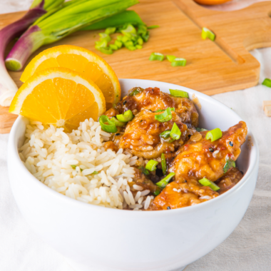 Bowl of Air Fryer Orange Chicken in white bowl.