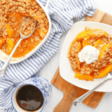 Golden brown Air Fryer Peach Crumble served warm in a white dish with a scoop of vanilla ice cream on top.