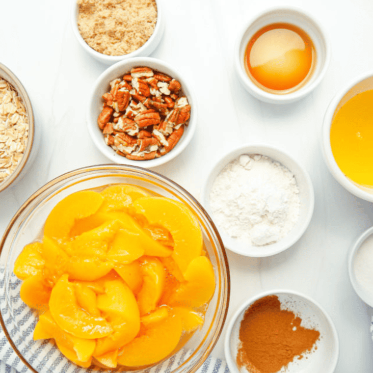 Ingredients needed for Air Fryer Peach Crumble, on kitchen table.