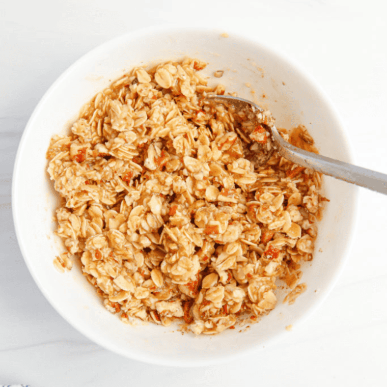 Lightly coat your pan with nonstick spray, then pour in the peach mixture. Use an air fryer-safe pan, baking pan, or dish that fits your air fryer basket. Sprinkle the crumble topping evenly over the peaches.
