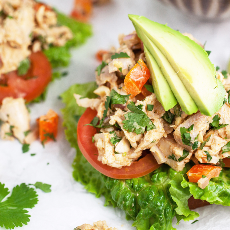 Fresh ingredients for Air Fryer Southwestern Chicken Salad including lettuce, tomatoes, and peppers.