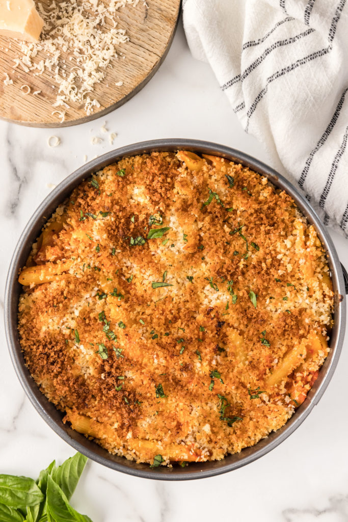 Serving Air Fryer Chicken Parmesan Casserole: A slice of chicken parmesan casserole topped with melted cheese and garnished with fresh herbs.