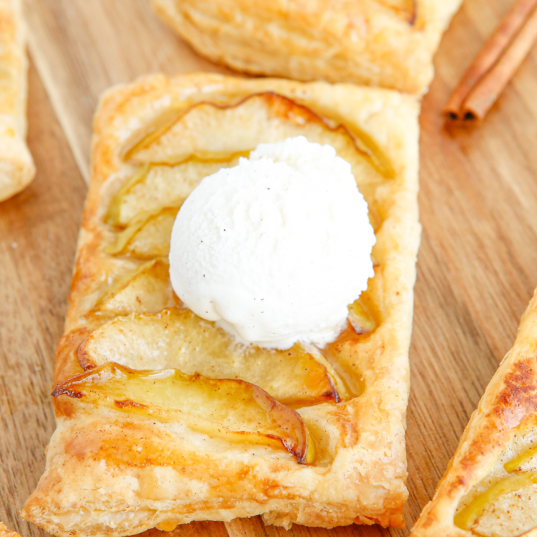 Close-up of a freshly baked Apple Pie Puff Pastry with visible apple filling and cinnamon.