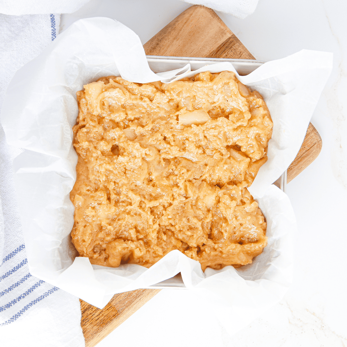 Place Copycat Applebee’s Butter Pecan Blondies into the batter.