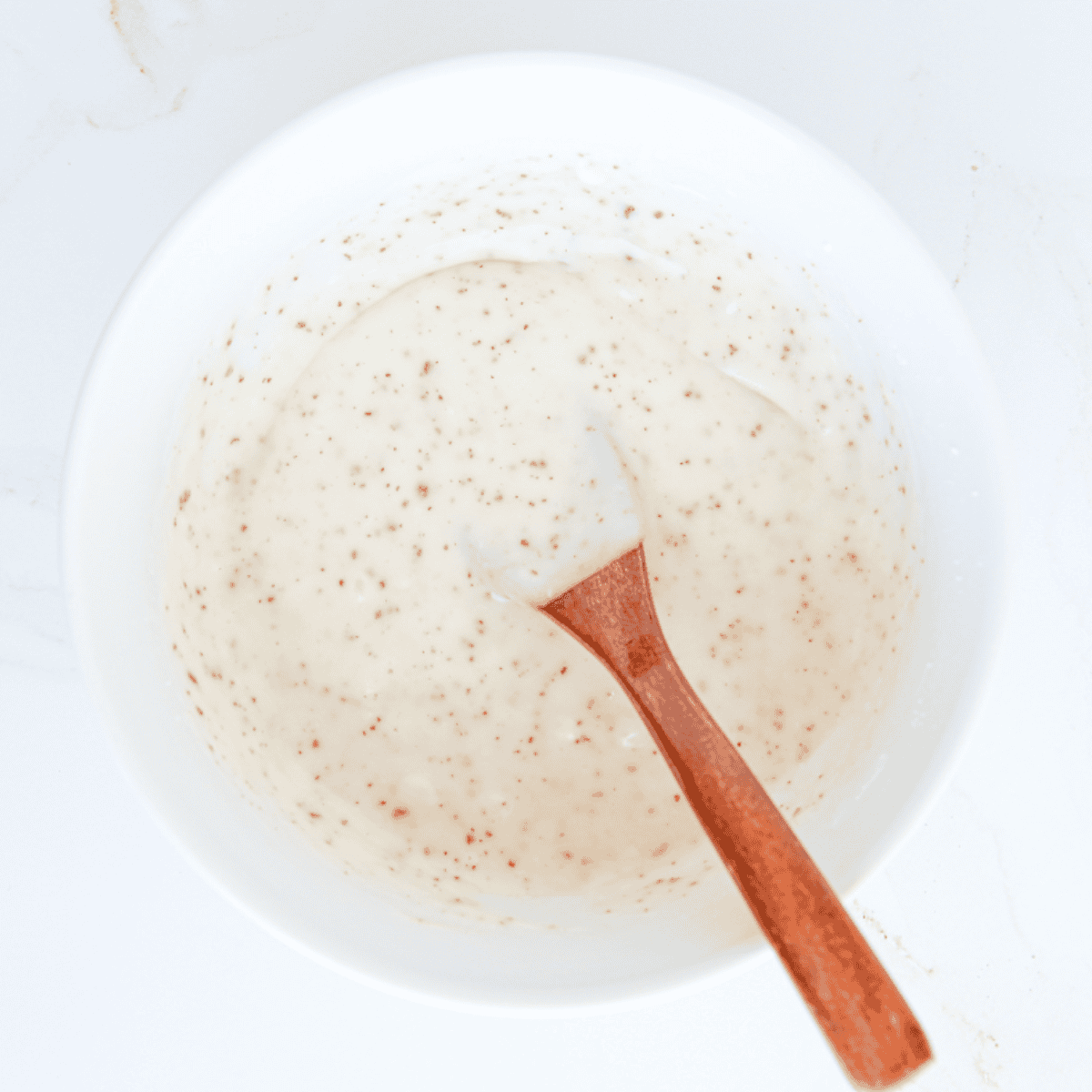 Add the sauce into a large mixing bowl.