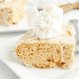 Close-up of Copycat Applebee’s Butter Pecan Blondies topped with pecan butter sauce and vanilla ice cream.