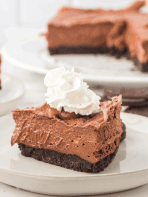 Homemade Copycat Cheesecake Factory Godiva Chocolate Cheesecake with layers of chocolate cake, cheesecake, and ganache.