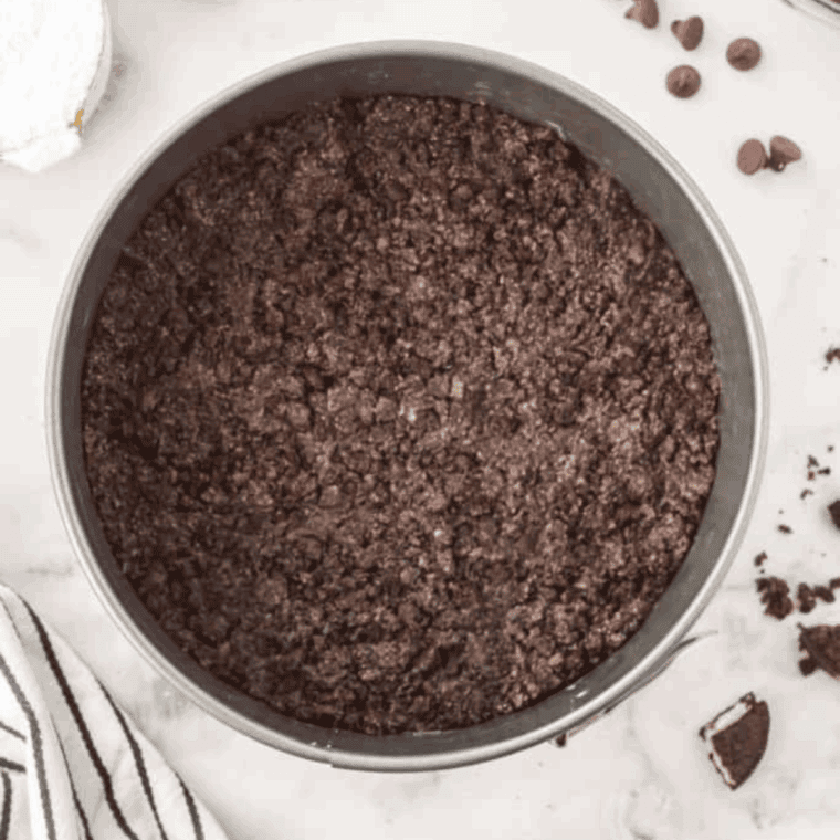 Press your crushed Oreos into the prepared pan.