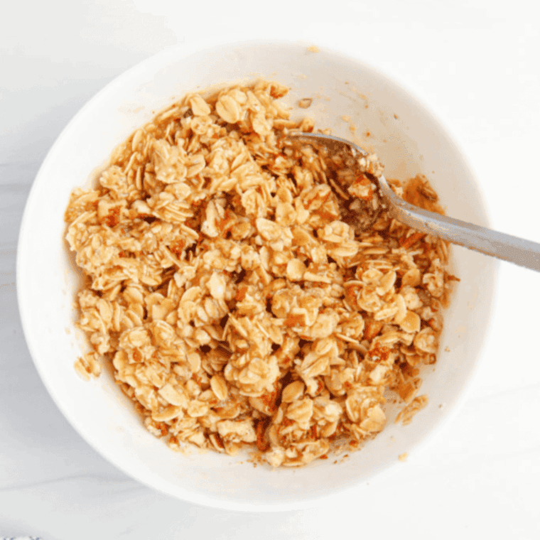 Lightly coat your pan with nonstick spray, then pour in the peach mixture. Use an air fryer-safe pan, baking pan, or dish that fits your air fryer basket. Sprinkle the crumble topping evenly over the peaches.