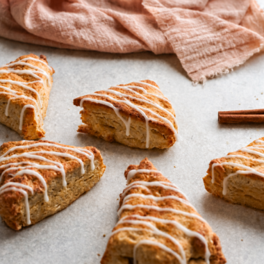 Overhead view of glazed air fryer apple scones with visible pieces of diced apple