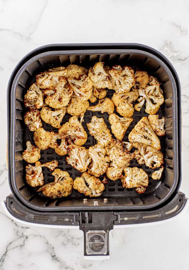 The cauliflower should taste crisp and crunchy, not overcooked. The exterior should be slightly charred but not overly darkened. You only need 5-7 minutes to air fry it and then if needed to brown more fry for 2 or so minutes extra.