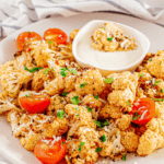 Air-Fryer-Cauliflower-and-Tomatoesgetables for extra variety? Whatever you choose to do, our air fryer cauliflower with tomatoes dish is sure to be a hit!