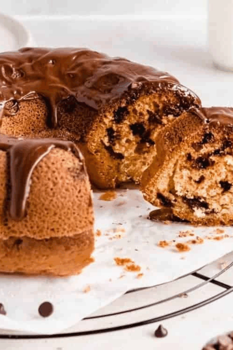 Golden chocolate chip bundt pound cake cooked in an air fryer, sliced and ready to serve.