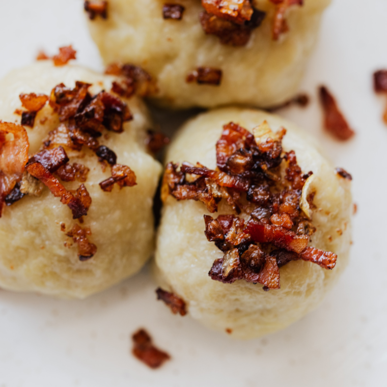 bacon bits on top of dumplings.