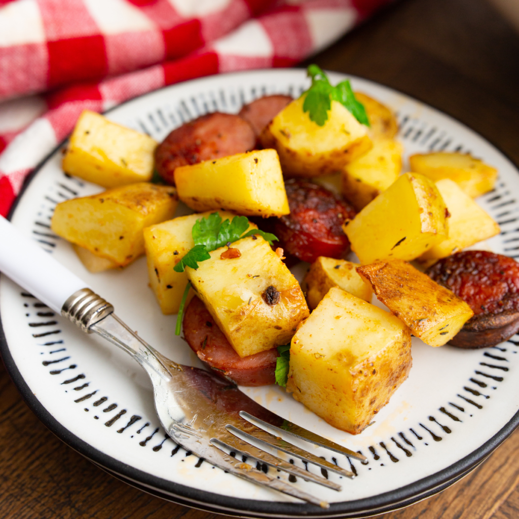 Air Fryer Kielbasa and Potatoes on a white plate.