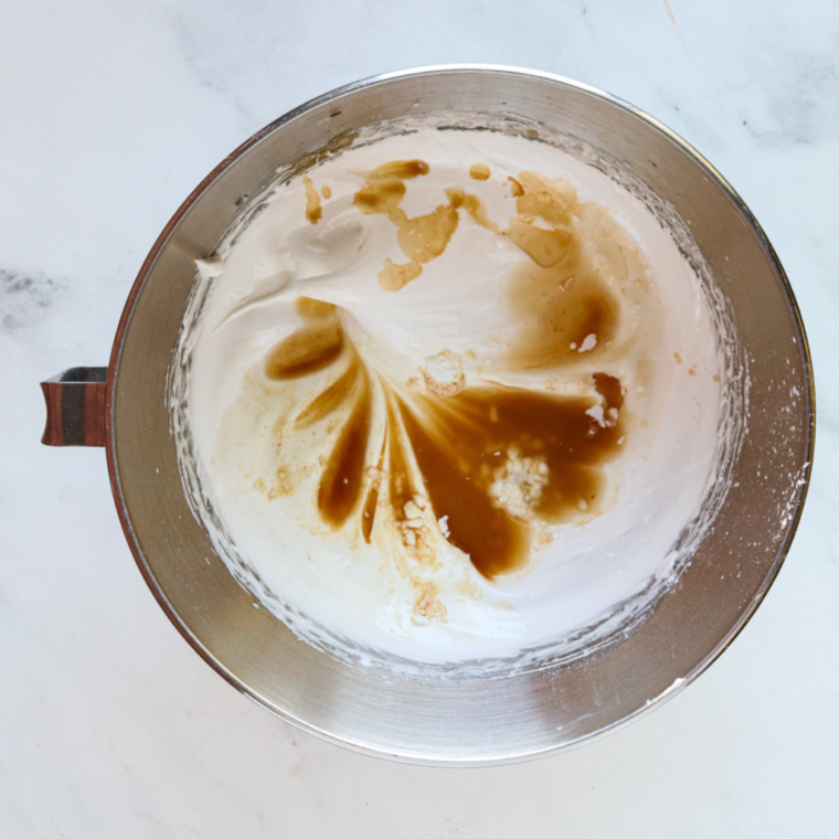 overhead process shot: the ingredients for air fryer meringue in a large metal bowl