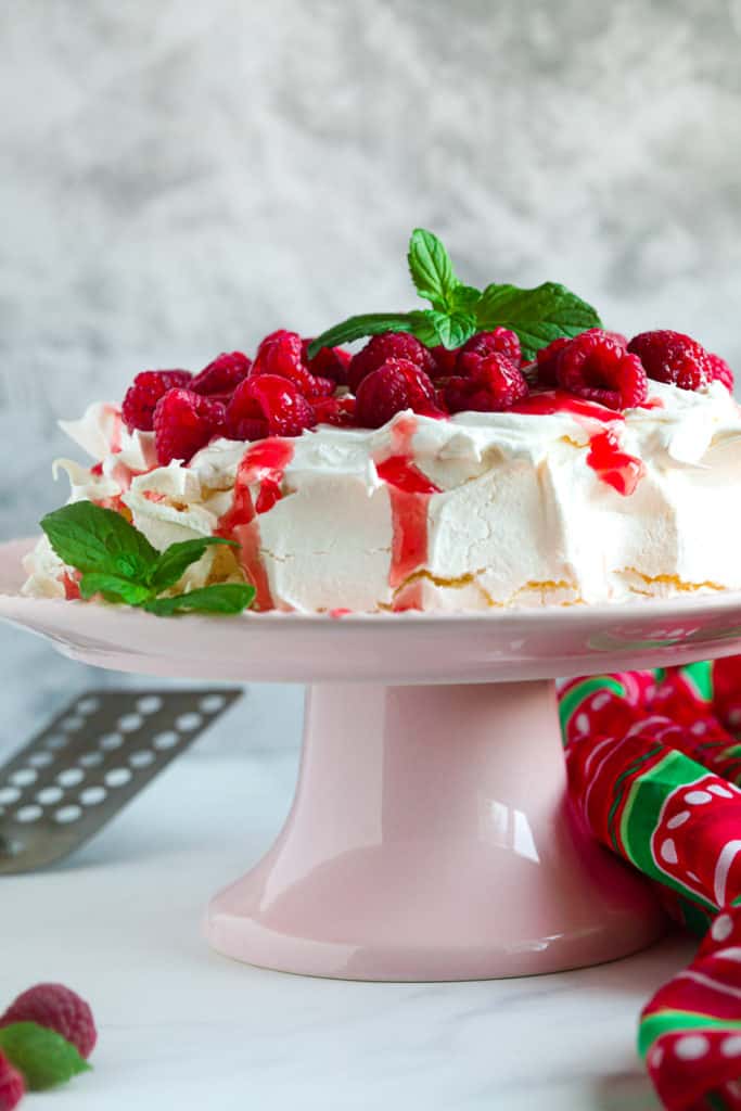 side view: air fryer meringues with whipped cream and fresh berries on top