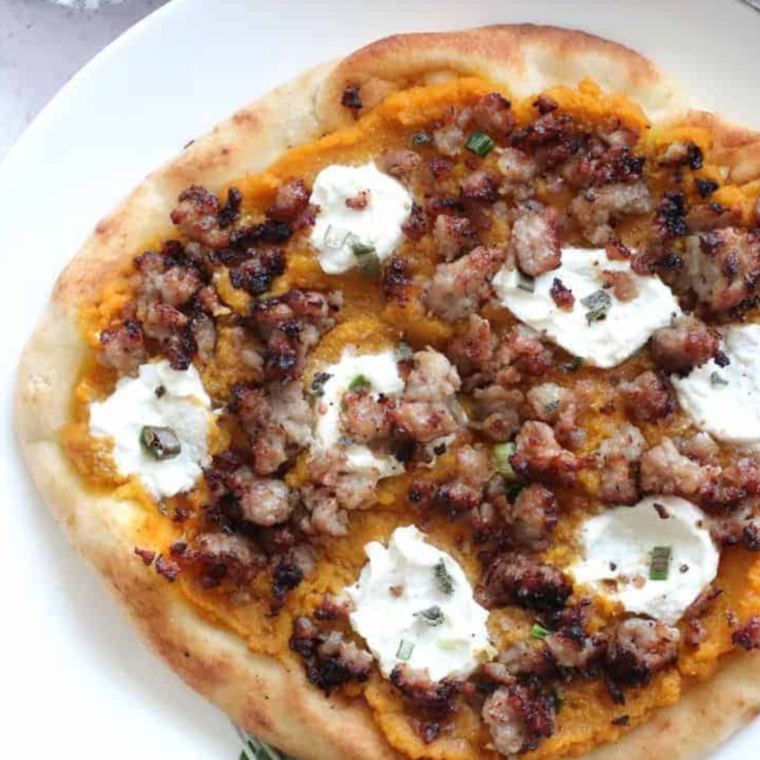 A freshly cooked Air Fryer Savory Pumpkin Ricotta Pizza with a golden crust, creamy ricotta, and roasted pumpkin toppings.