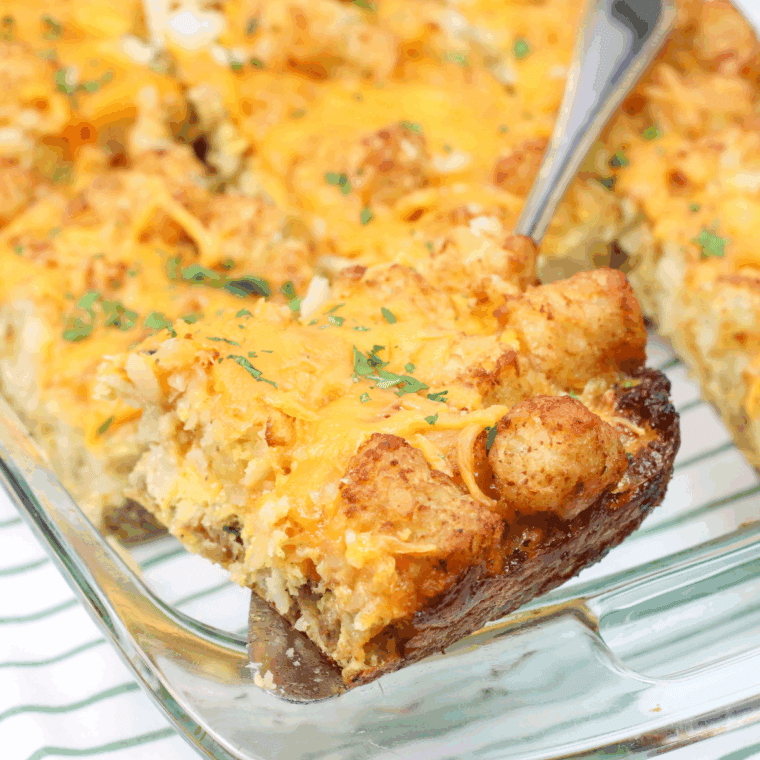 Cheesy air fryer tater tot casserole in a baking dish with golden, crispy tots on top.