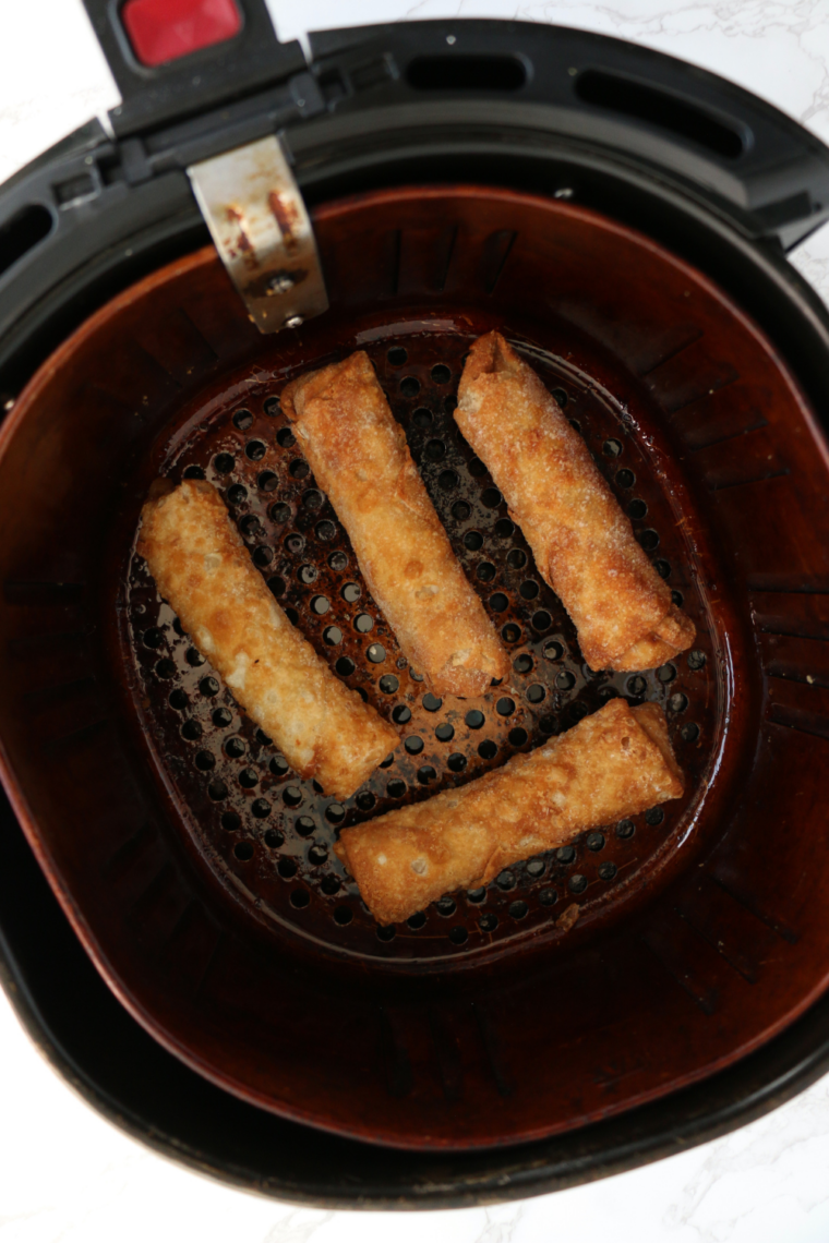 Frozen Chung's egg rolls arranged in a single layer with space between each one