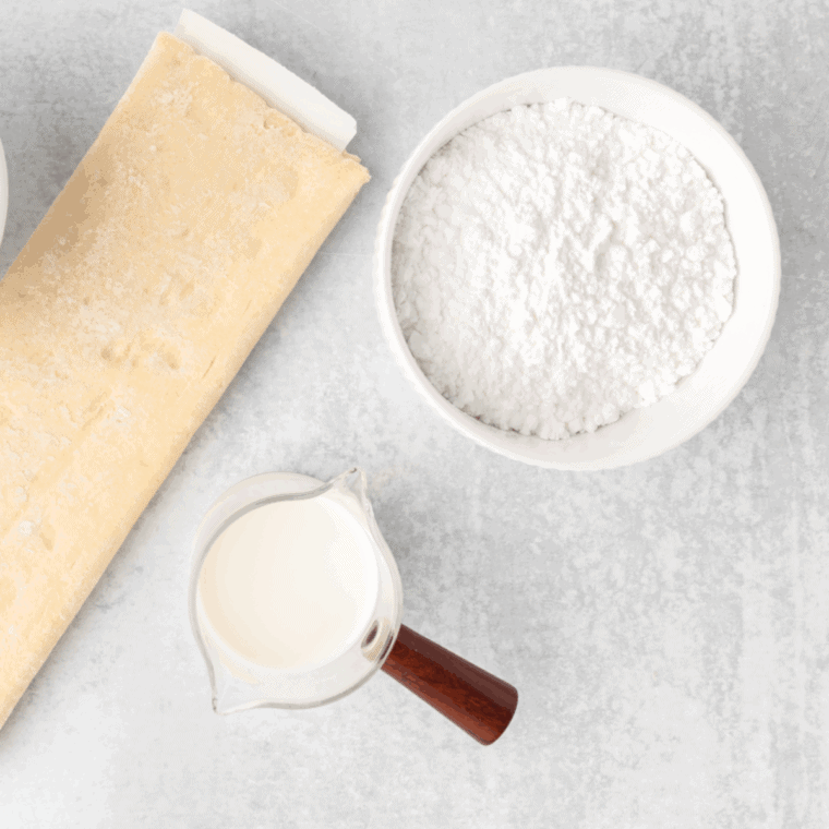 Ingredients needed for Easy Air Fryer Strawberry Hand Pies on kitchen table.