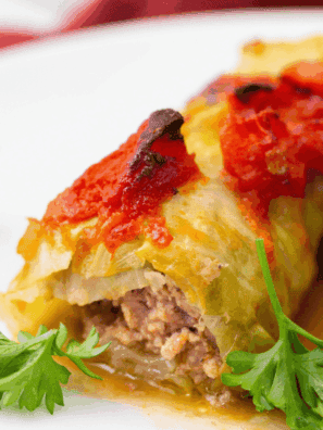 Air fryer stuffed cabbage rolls on a plate, filled with seasoned ground meat and rice, ready to serve.